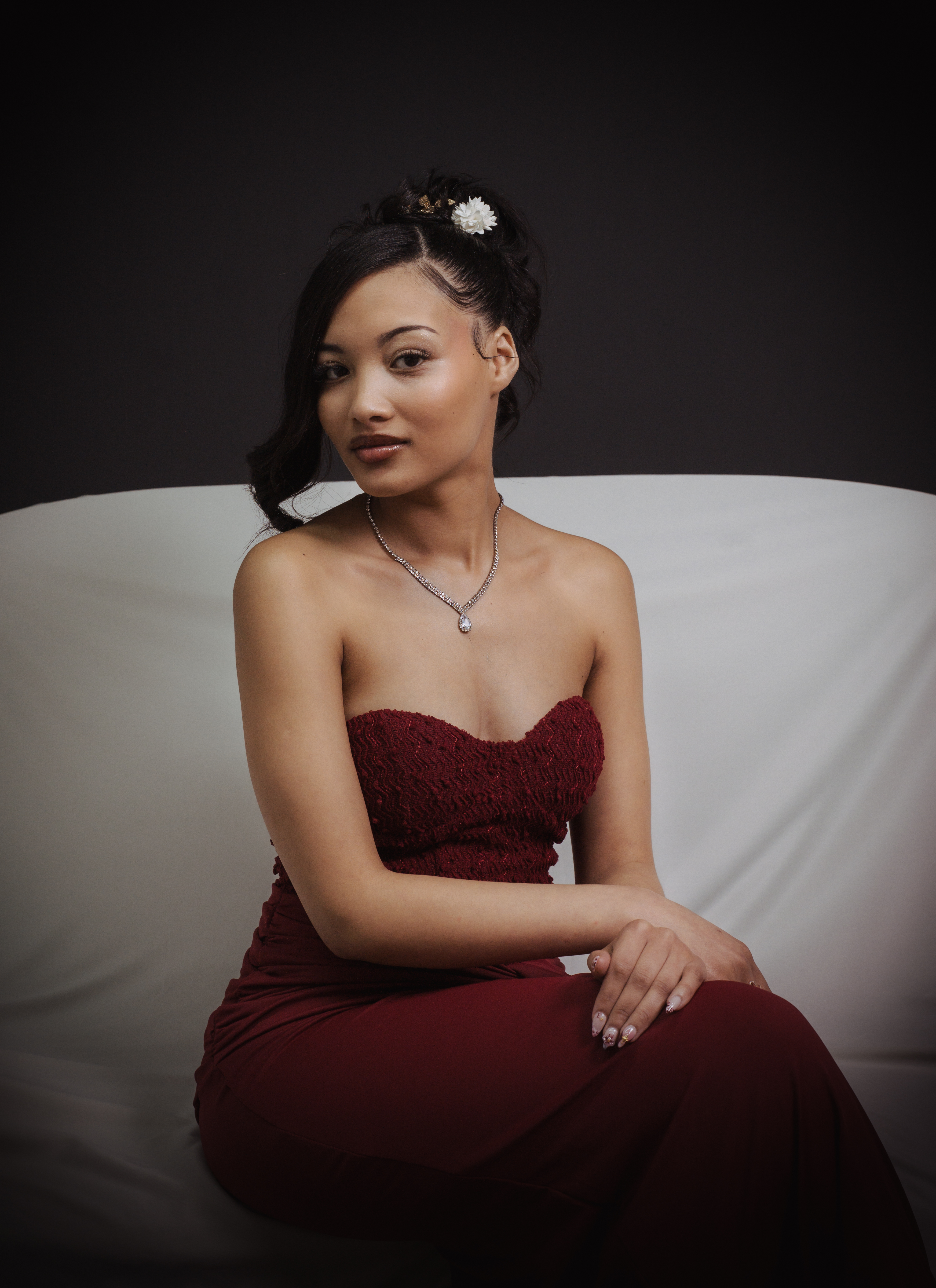 Elegant studio portrait in a burgundy dress