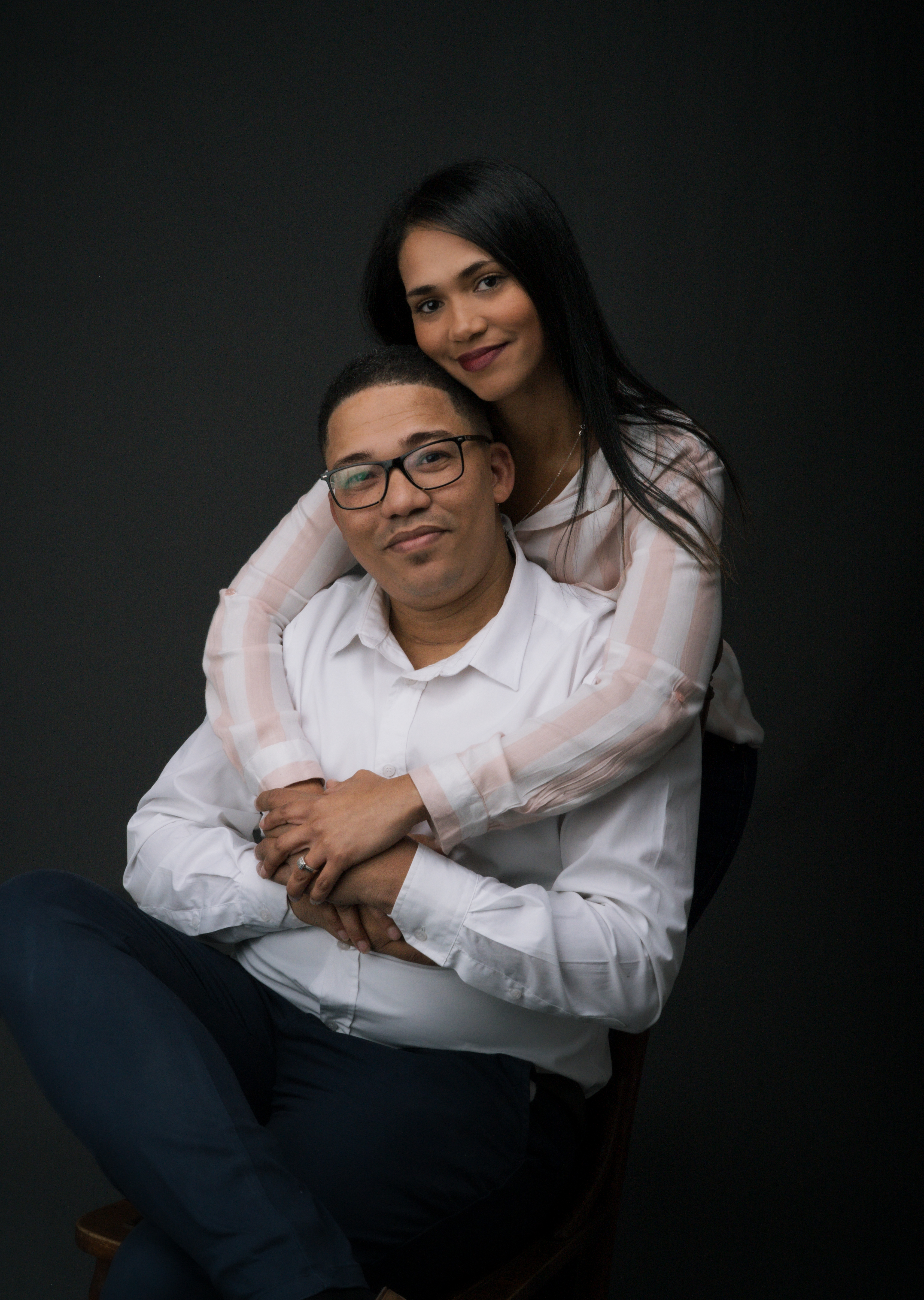 A couple embracing in the studio