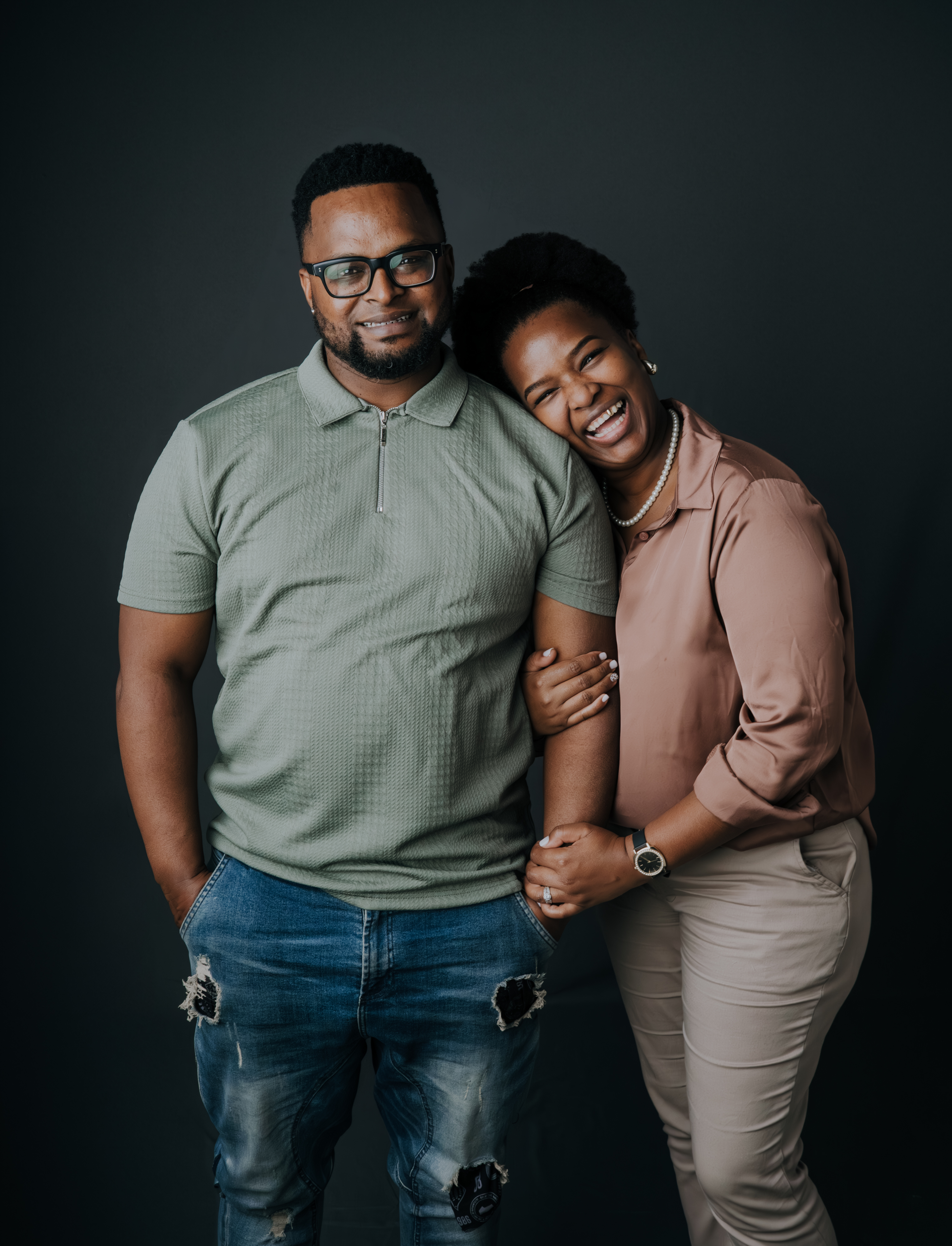 Couple sharing a joyful moment in the studio