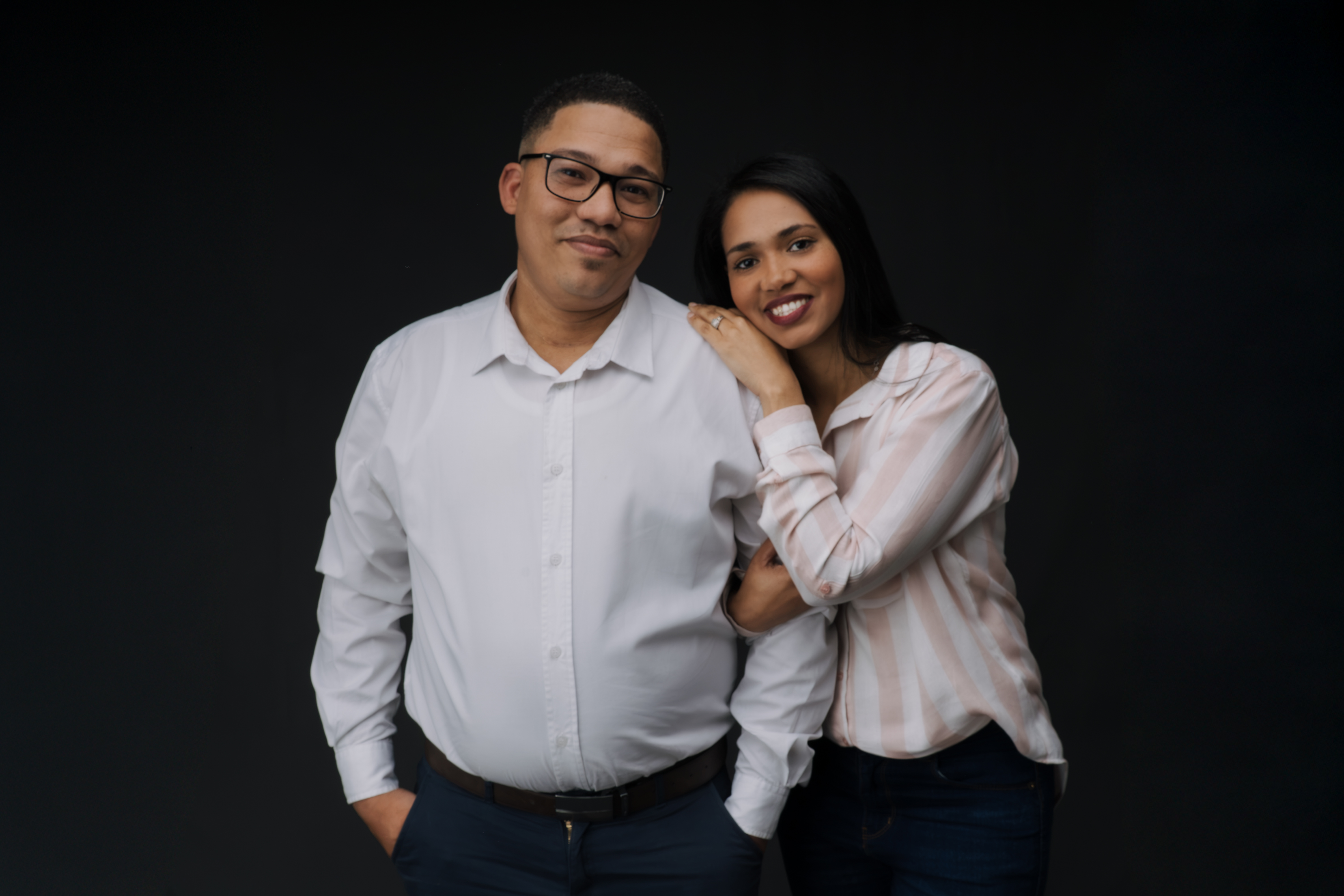 A standing studio portrait of a couple