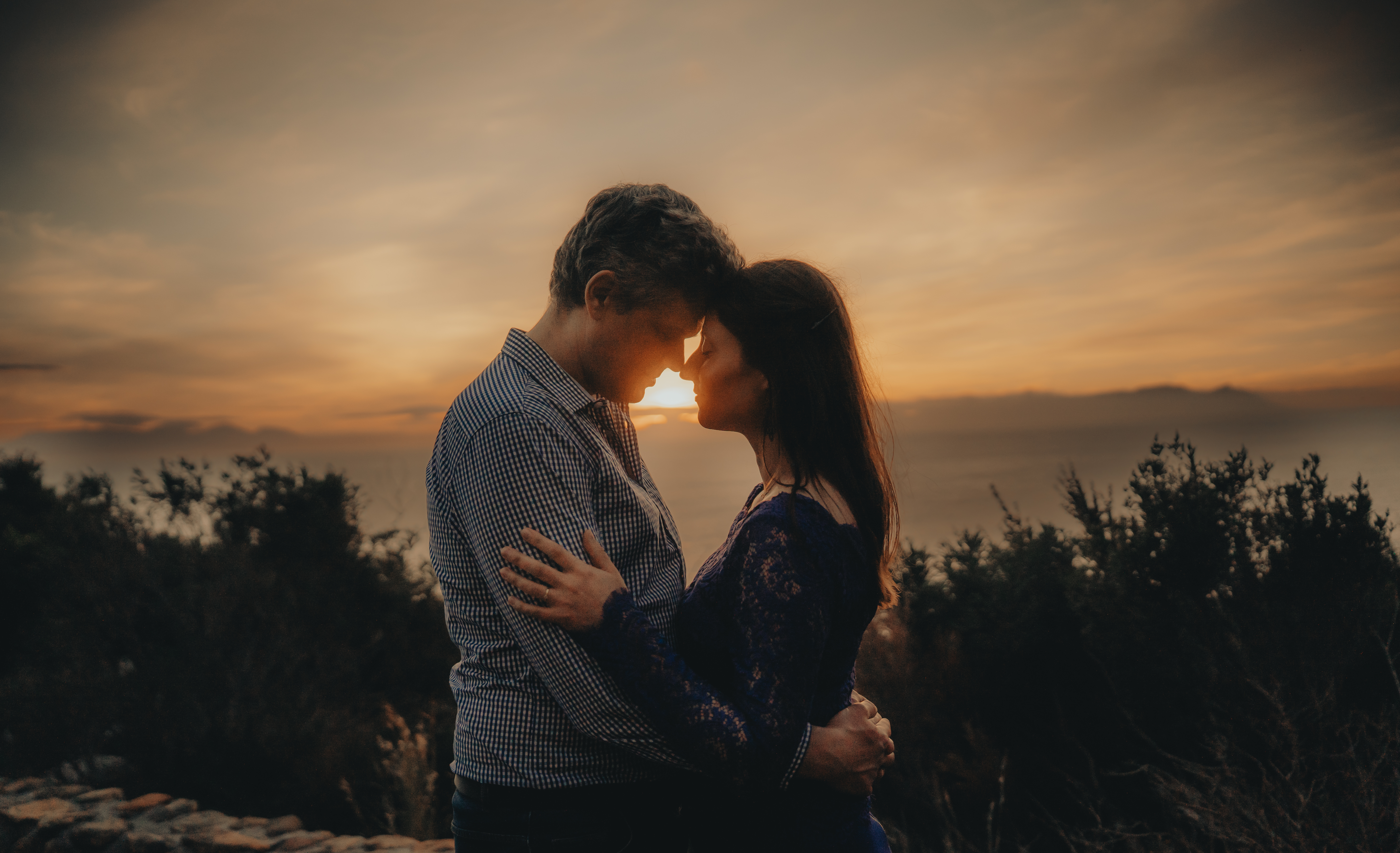 A couple together in a sunset silhouette