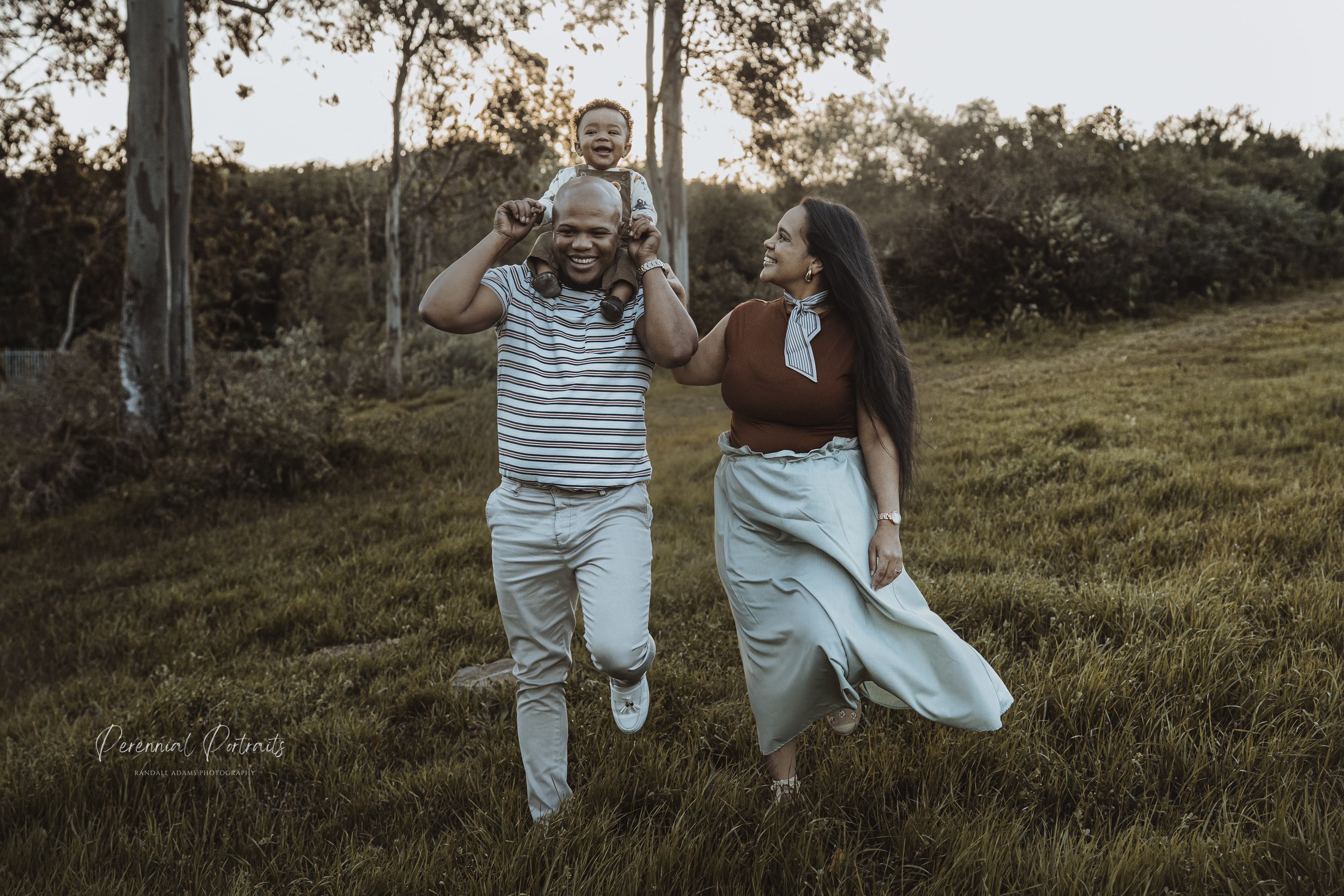 Family laughing together outdoors
