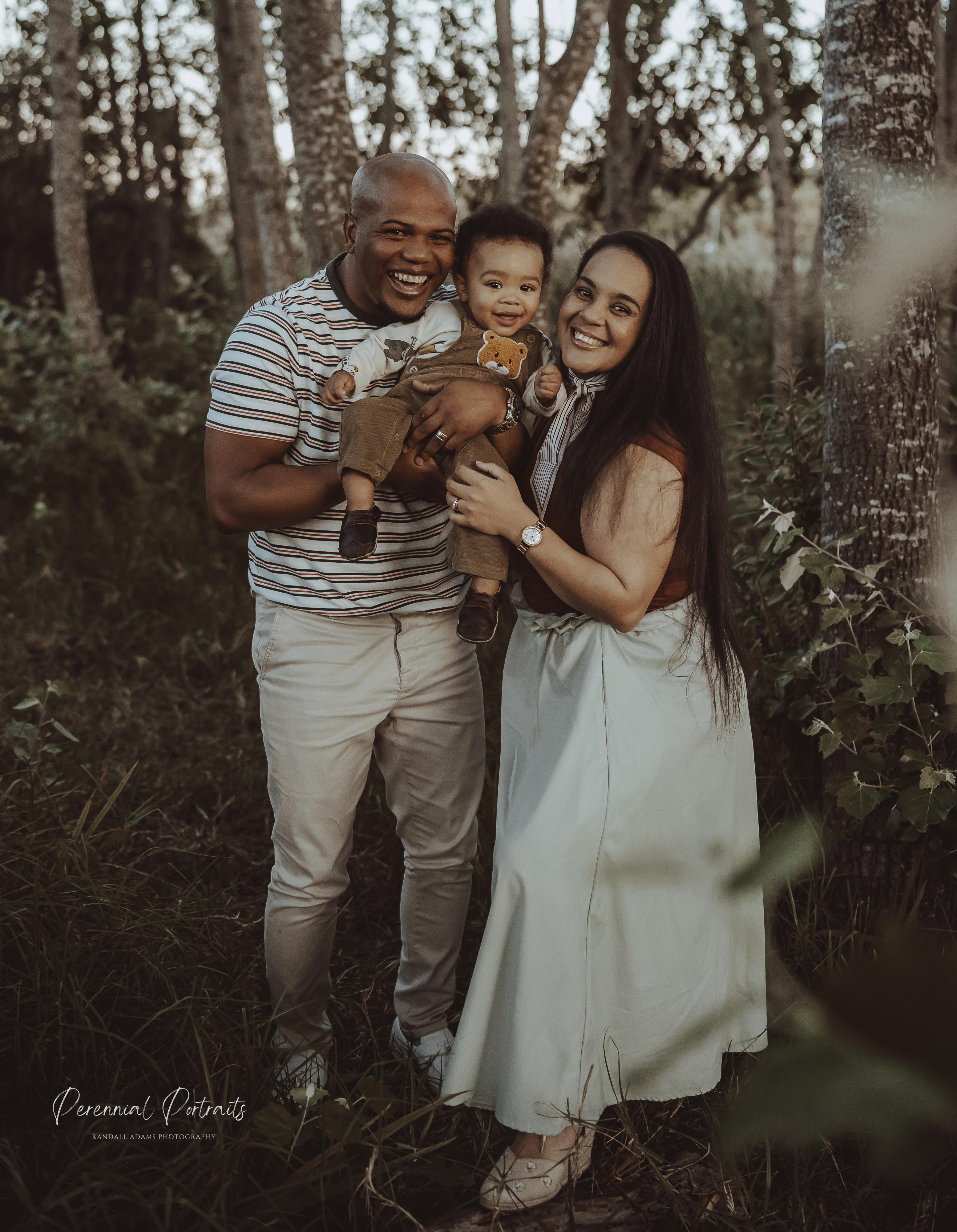 Family portrait in a wooded setting