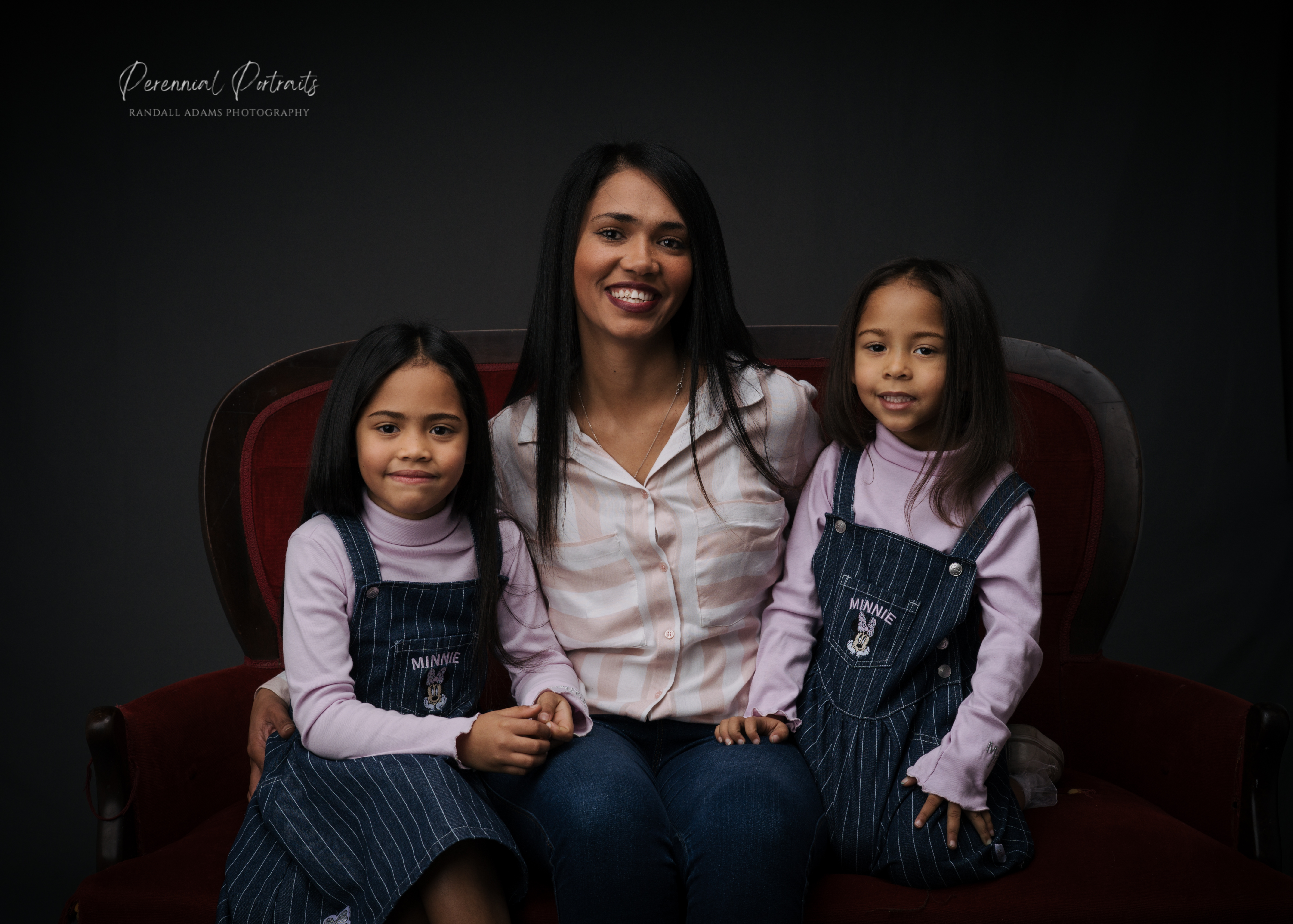 Mother sitting with her two daughters