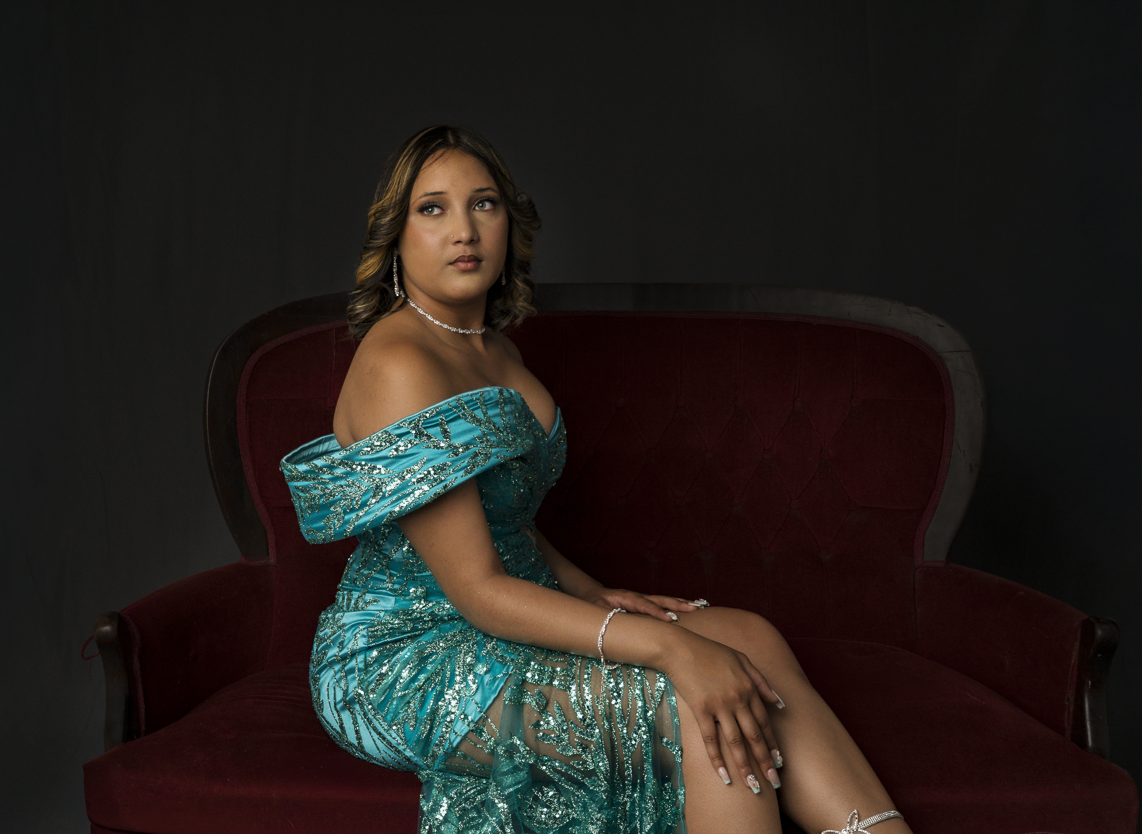 Studio portrait in a teal evening dress